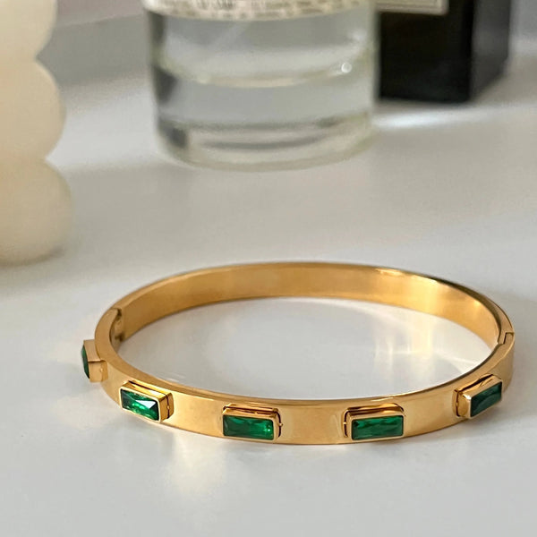 18k gold plated with emerald cut green stone